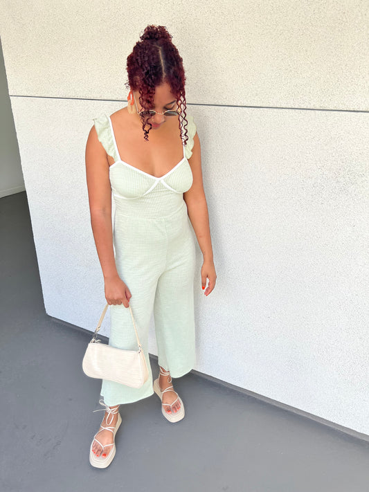 women in a white dress with red hair smiling
